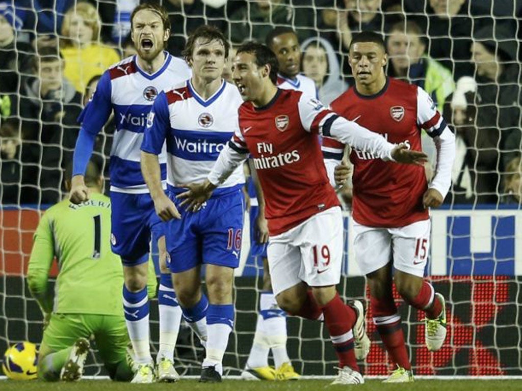 Arsenal's Santi Cazorla celebrates after scoring past Reading's keeper Adam Federici (left)