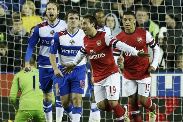 Arsenal's Santi Cazorla celebrates after scoring past Reading's keeper Adam Federici (left) 
