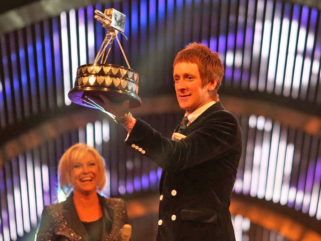 Bradley Wiggins collects his Sports Personality of the Year award on Sunday night