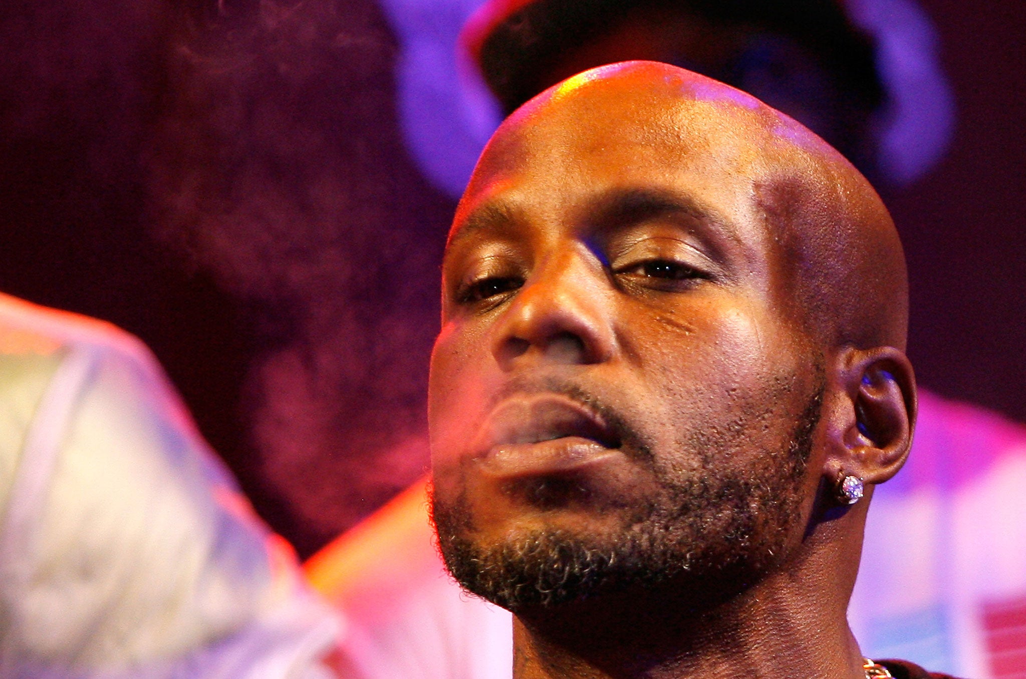 Rapper DMX smokes a cigarette during the 2012 Rock the Bells Festival press conference on June 13, 2012 in New York City.