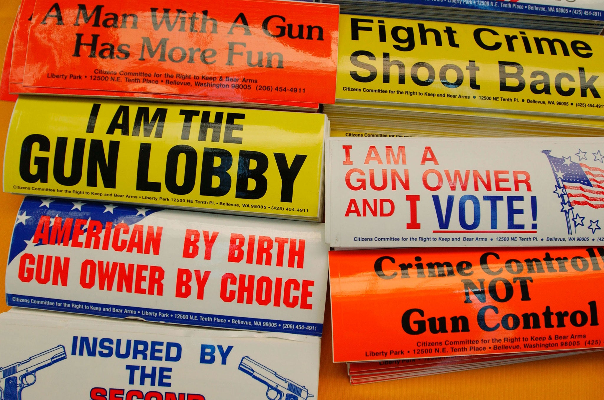 Bumper stickers hang for sale at the Second Amendment Foundation booth before the 133rd Annual NRA Convention at the David L. Lawrence Convention Center April 15, 2004 in Pittsburgh, Pennsylvania.