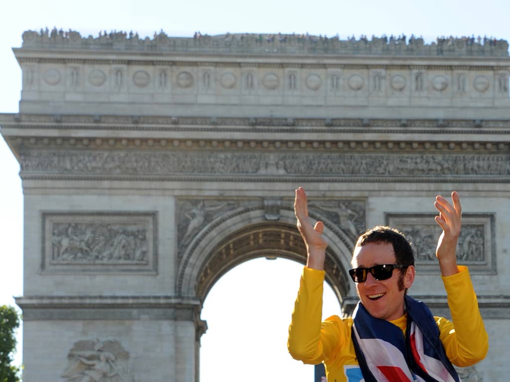 Bradley Wiggins wears the yellow jersey in Paris