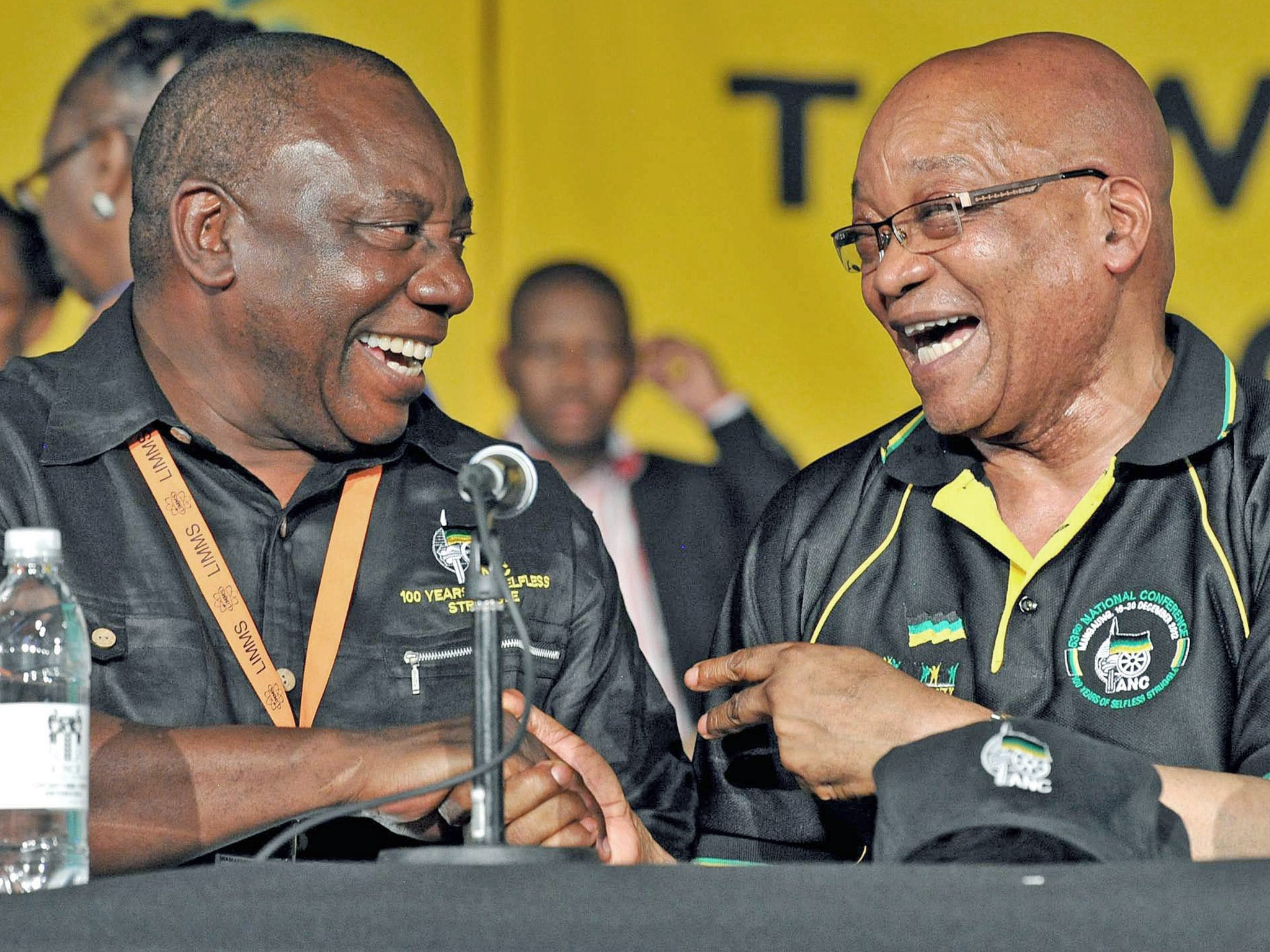ANC President, Jacob Zuma, right, celebrates his re-election with new deputy leader, Cyril Ramaphosa