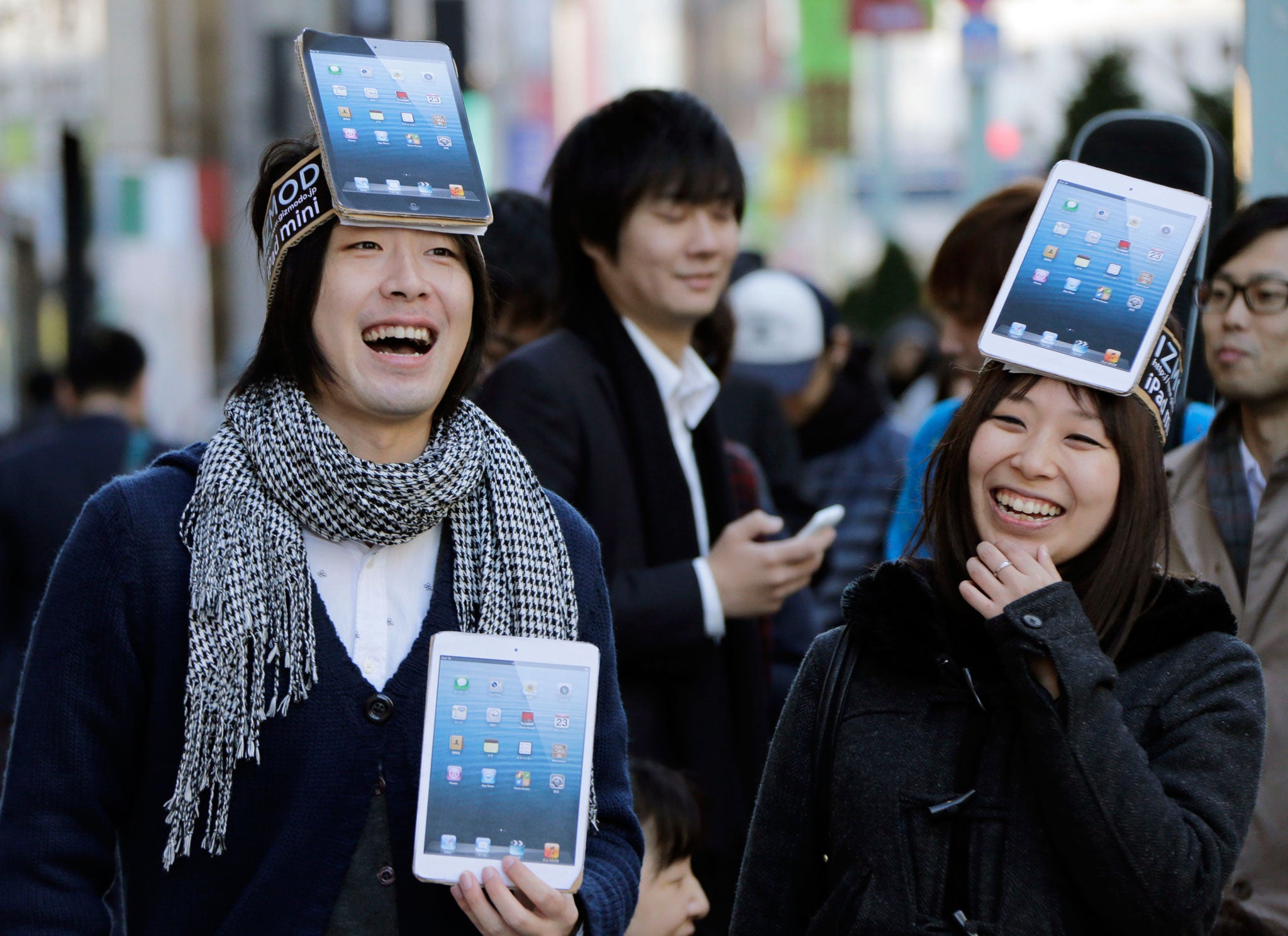 Satisfied Tokyo customers with their new iPad Minis