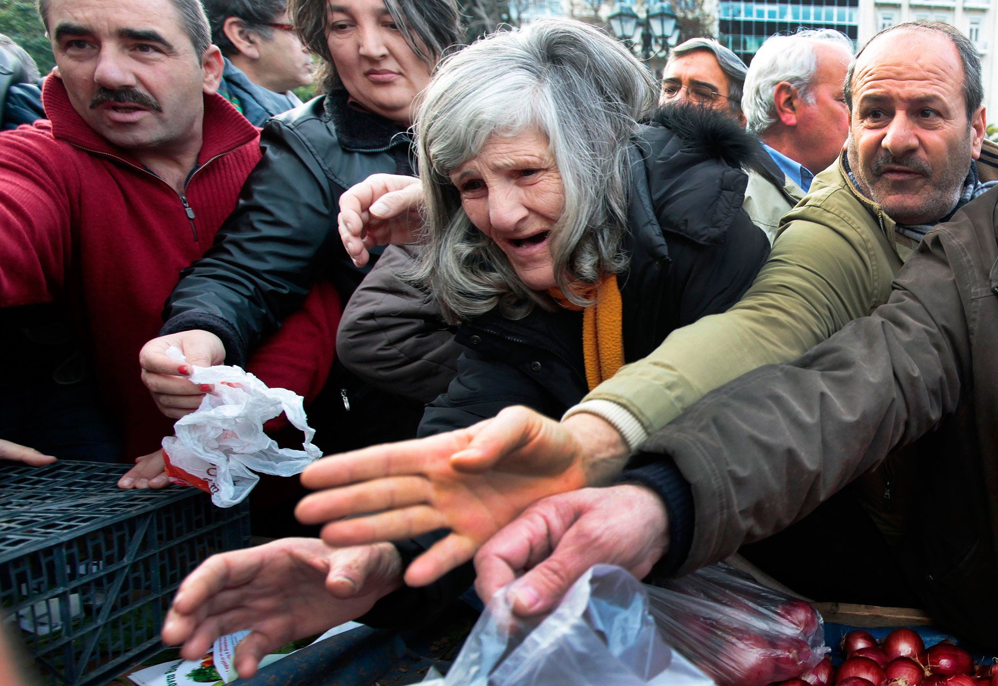Greeks struggling to get free food in Athens in January 2012