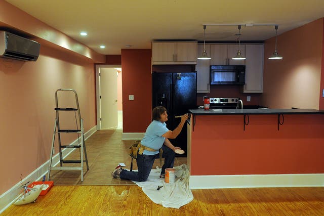 HANDYWOMEN: Cecilia Moore, a contractor, adds finishing touches to a basement apartment in Mount Pleasant that she is renovating. Moore comes from a family that has long worked in home repairs. Until recently, home repair was seen as a male-dominated terr