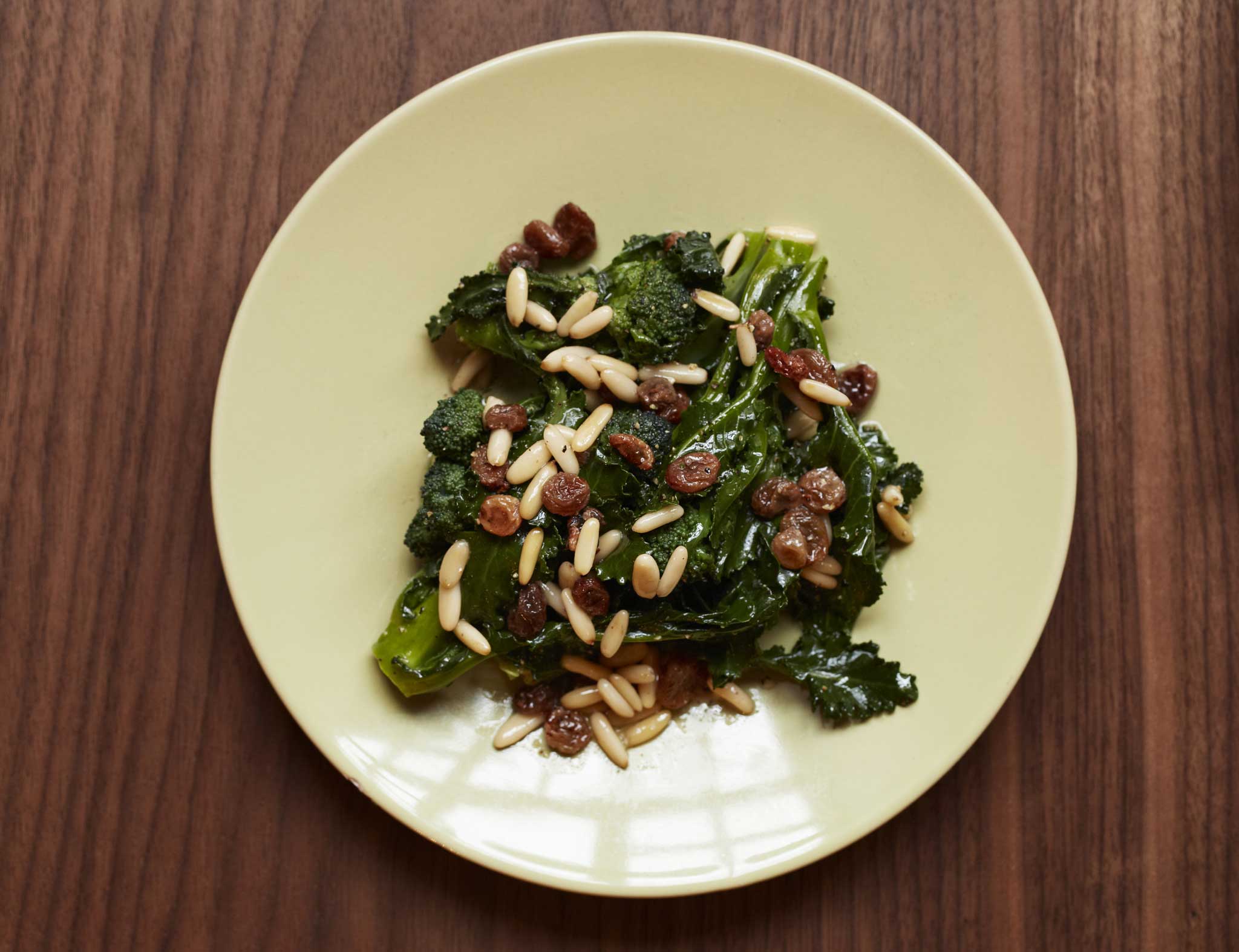 Sprouting broccoli salad with raisins and pine nuts