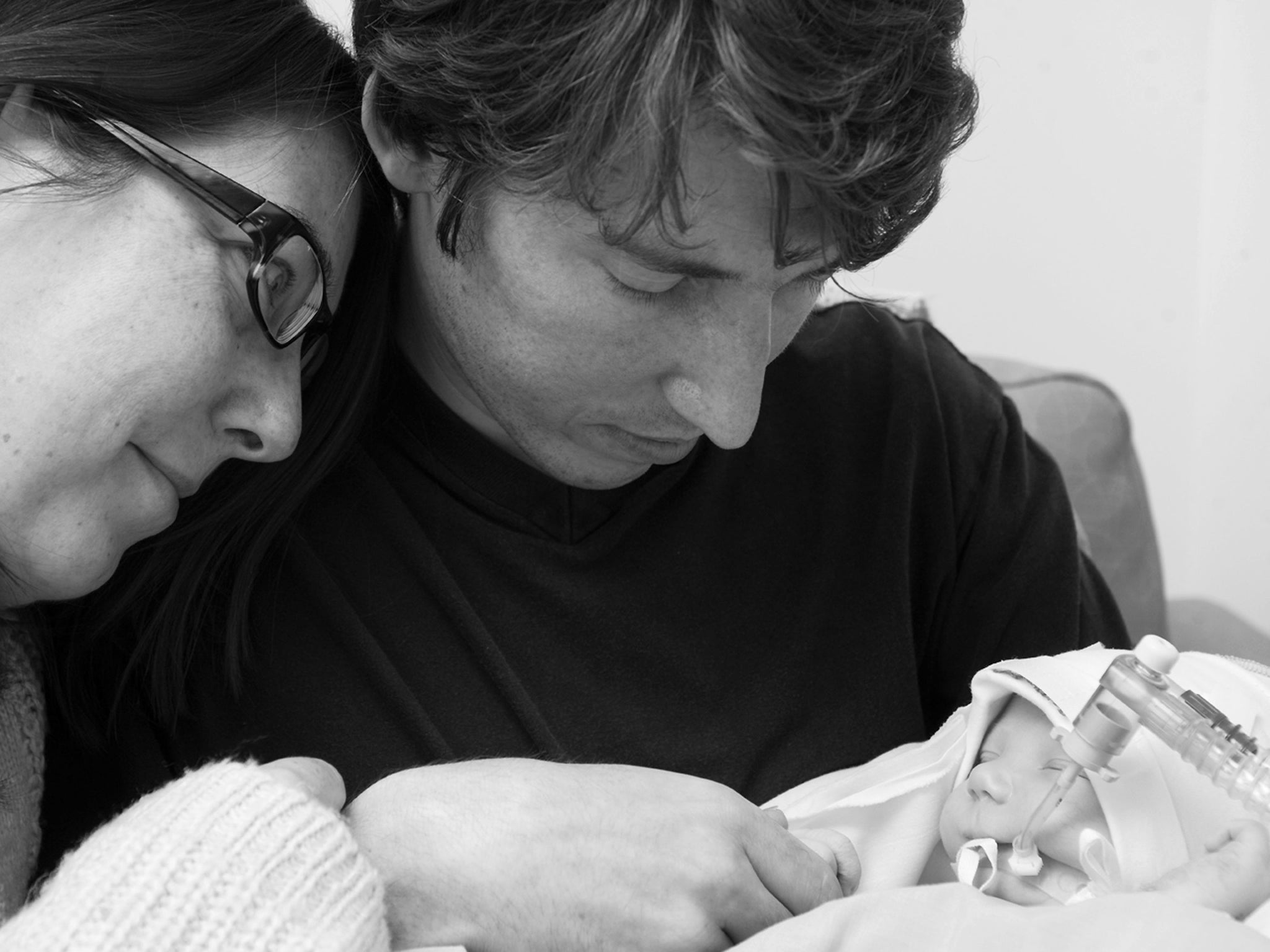 A black-and-white photograph issued courtesy of Sands (Stillbirth and neonatal death charity) of Natasha and Kent Fermor, from Coventry, with their baby son Lucas, who died after medics failed to spot he was being starved of oxygen during labour