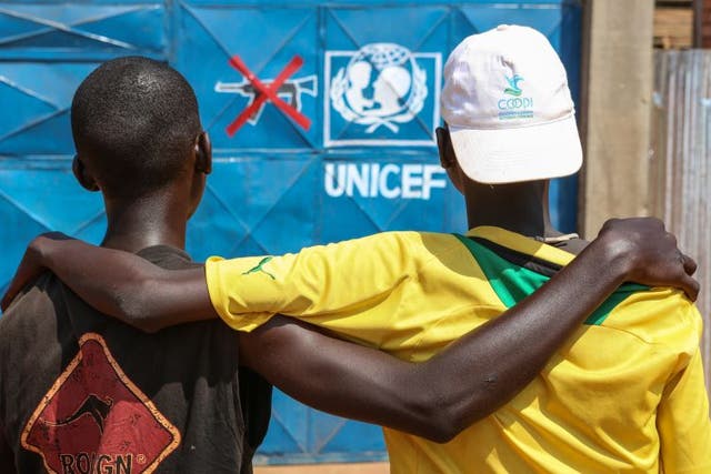 The Unicef transit centre in Bria. Here two of the former child soldiers being helped at the site stand in front of the centre’s entrance gate. 