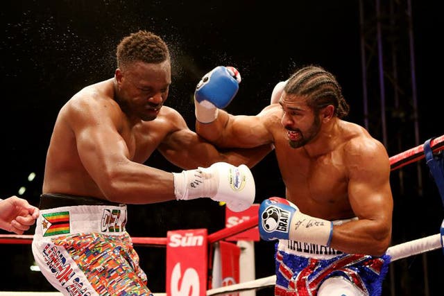 David Haye (right) has Dereck Chisora in trouble at Upton Park