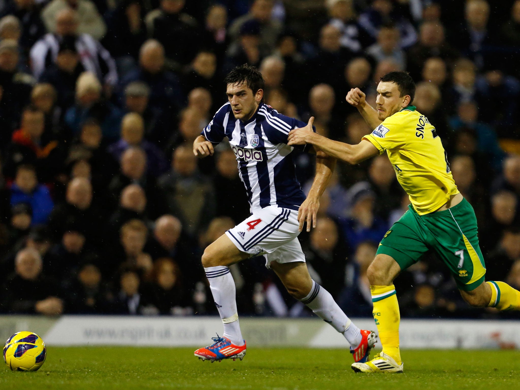Goran Popov of West Bromwich Albion and Robert Snodgrass of Norwich City battle for the ball