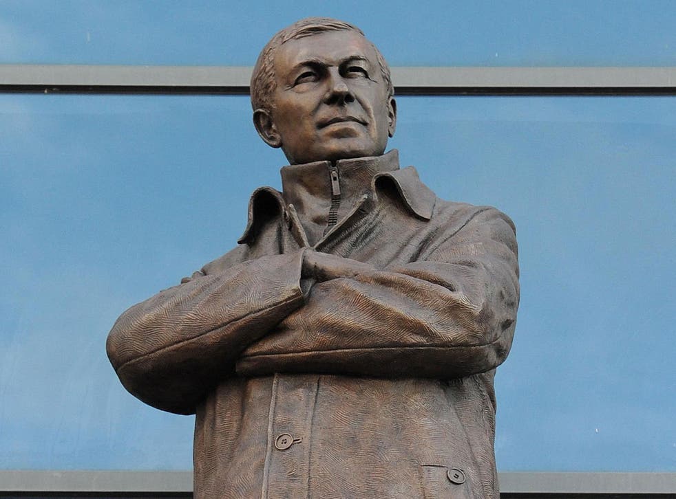 Silence is bronze: A strangely happy-looking statue of Sir Alex Ferguson