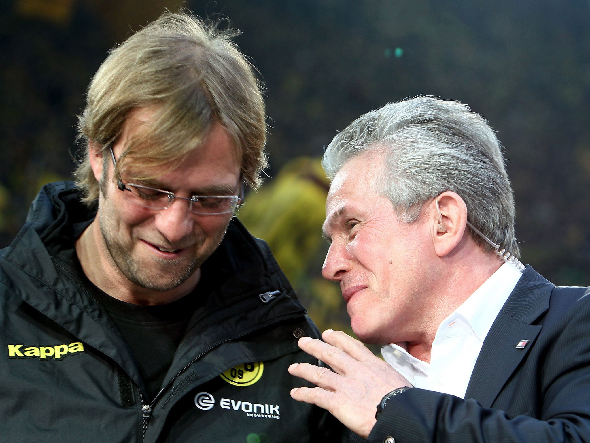 The last laugh: Bayern Munich’s manager, Jupp Heynckes (right), shares a joke with Dortmund’s Jürgen Klopp