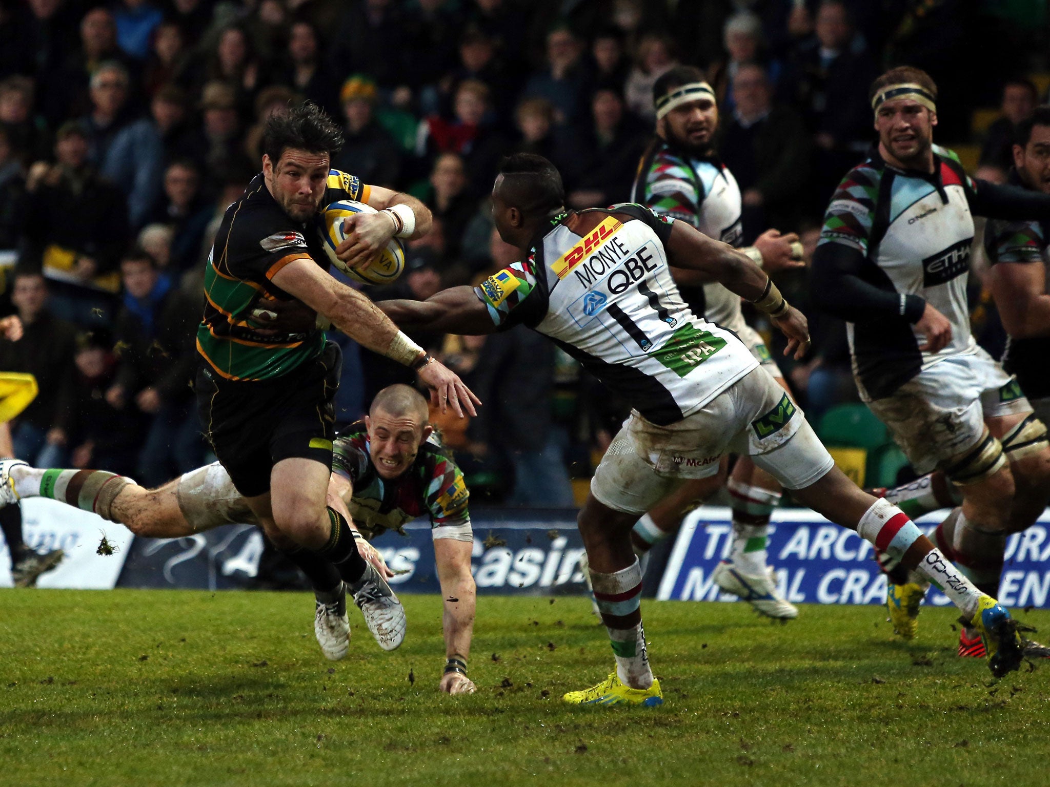 Back breaker Saints’ Ben Foden manages to evade Quins’ Mike Brown and Ugo Monye, but it was not to be Northampton’s day