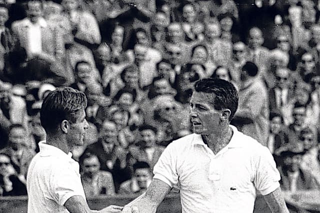 Larsen, right, shakes hands with his fellow-American Tony Trabert after losing to him in the final of the 1954 French Open 