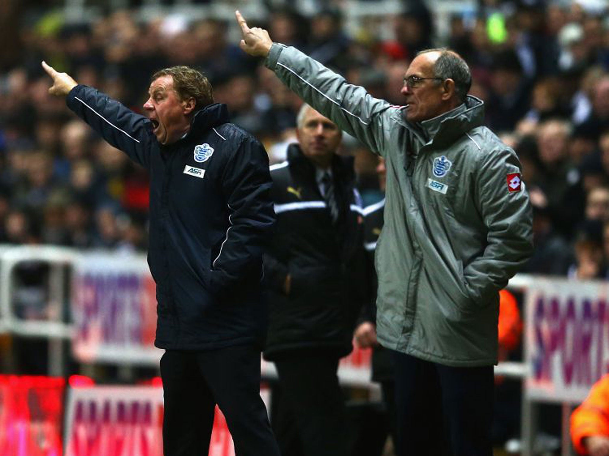 Harry Redknapp and his coach Joe Jordan point the way to their QPR players