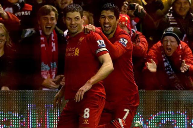 Steven Gerrard is congratulated by Luis Suarez after scoring against Fulham on Saturday