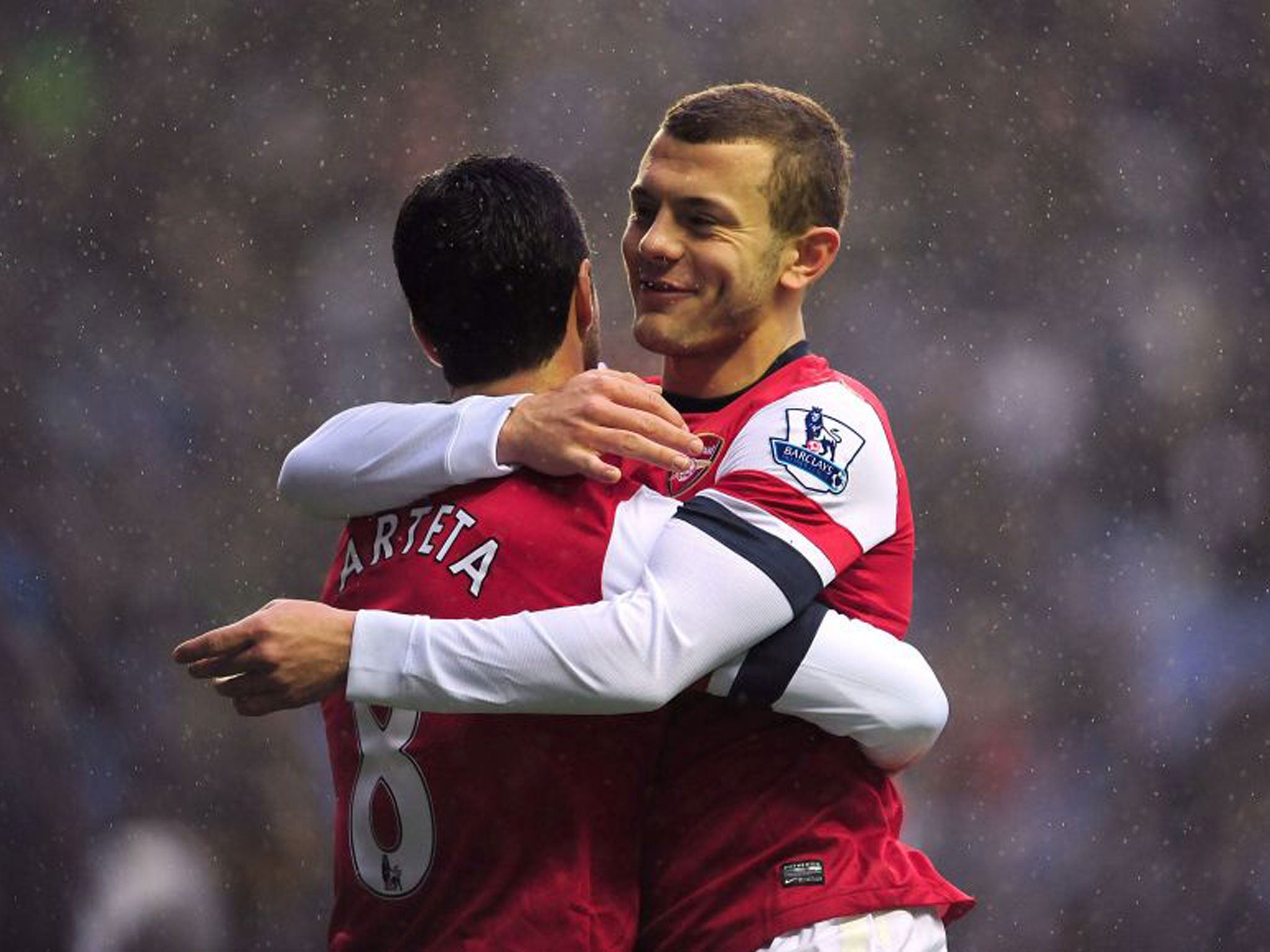 Mikel Arteta (left) celebrates his winning goal with Jack Wilshere