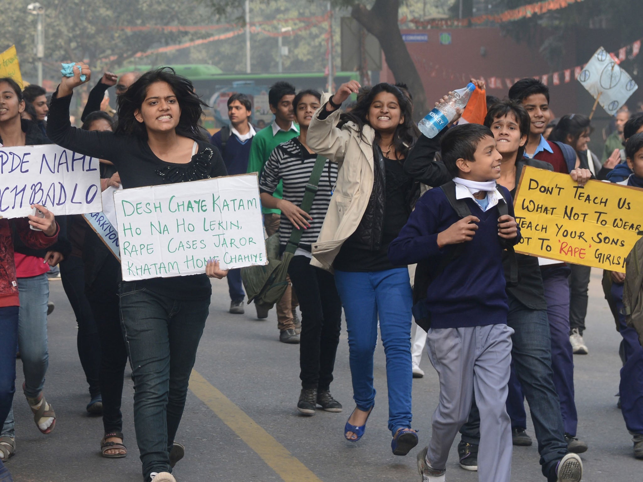 Indian demonstrators hold placards as they shout anti-government slogans during a protest calling for better safety for women following the rape of a student in New Delhi