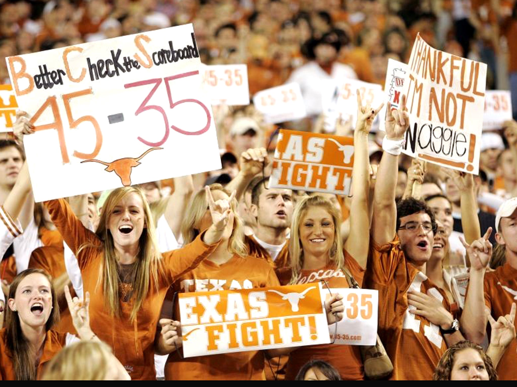 Fans in trademark burnt orange fill the 101,000-seater stadium that is home to the University of Texas Longhorns