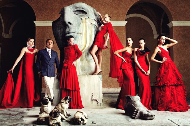 Red devils: Valentino with models wearing his dresses