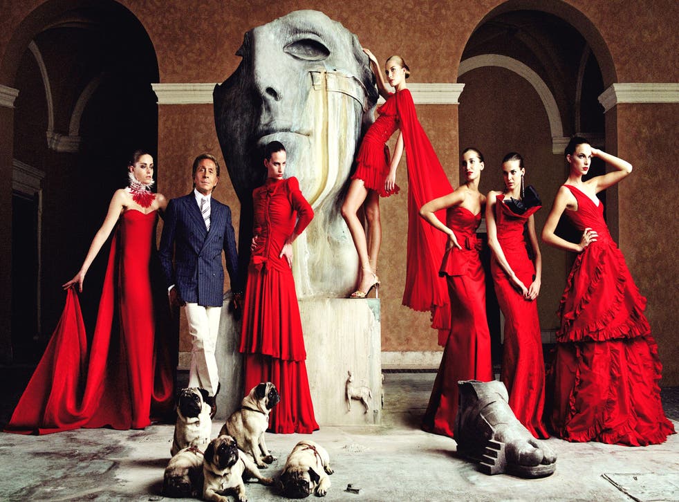 Red devils: Valentino with models wearing his dresses