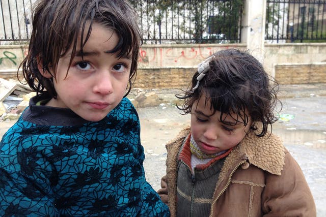 SYRIA: Baraa Labhan, 7, and his sister Fatme, 5, have been reduced to begging with their mother, Nadia, since their father was killed by a sniper two months ago. The price of bread has soared tenfold and many people are going hungry. 