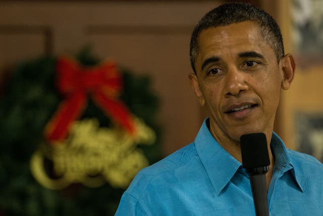 US President Barack Obama delivers remarks while visiting military personnel eating Christmas Dinner at Anderson Hall at Marine Corps Base Hawaii 