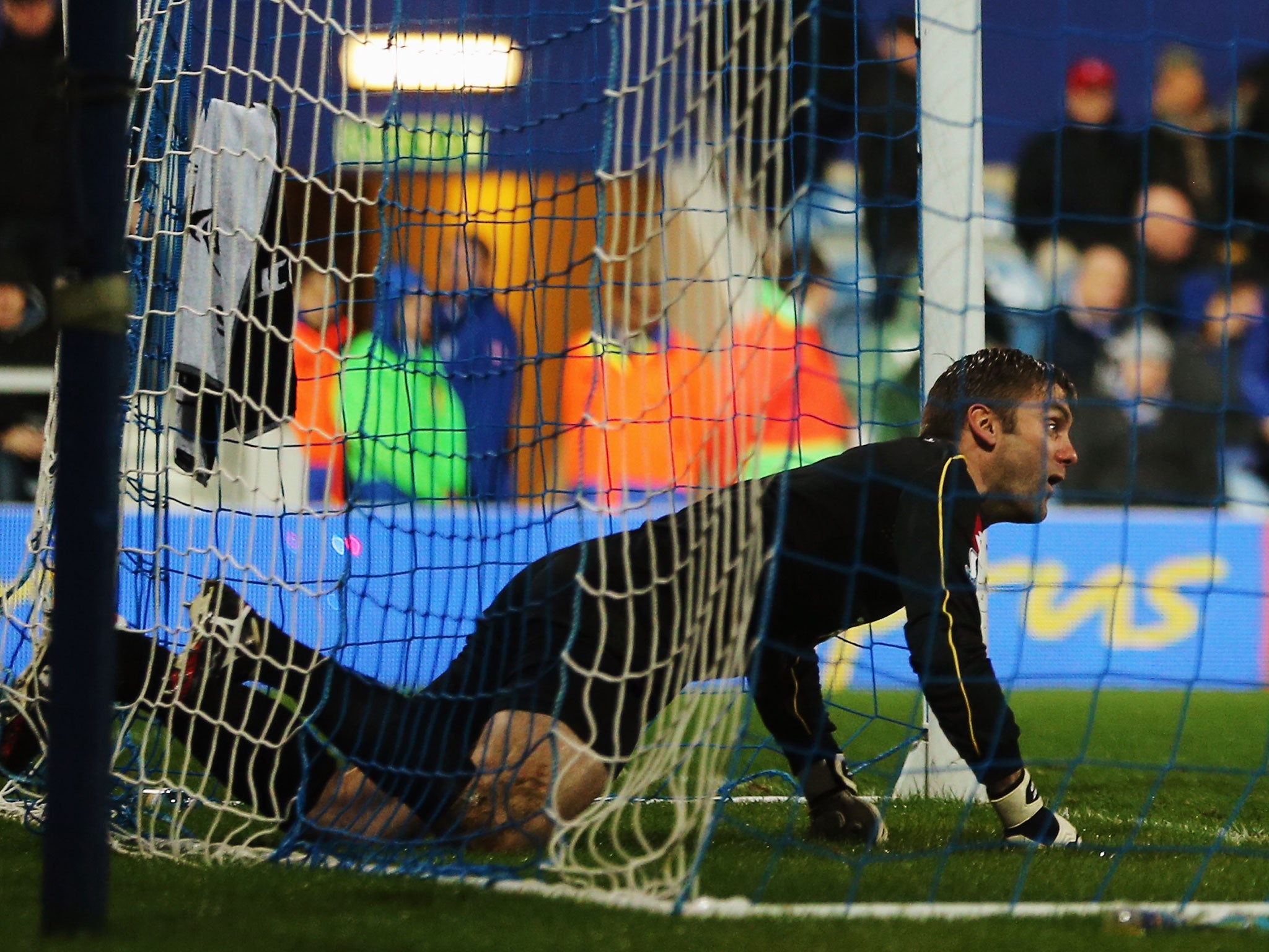 Robert Green reacts after putting the ball into his own net