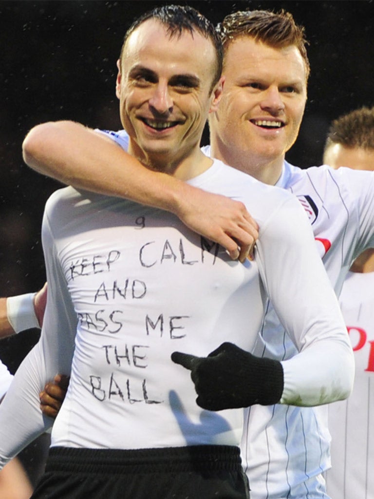 Dimitar Berbatov displays his T-shirt after scoring for Fulham