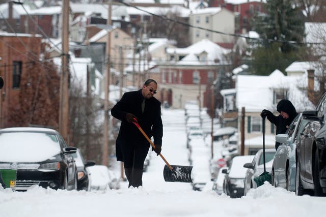 Pittsburgh, Pennsylvania: Residents shovel snow on Mt. Washington after a winter storm blanketed the Midwest with snow December 26, 2012