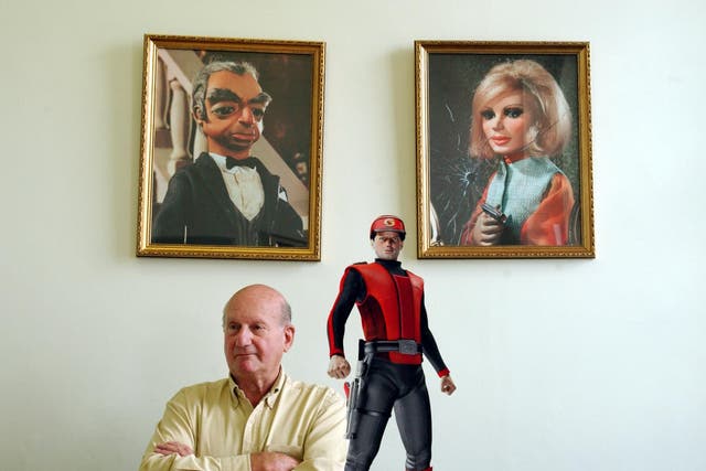 Anderson with three of his creations, Parker and Lady Penelope and, foreground, Captain Scarlet