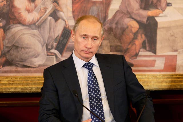 Vladimir Putin signs a bill to stop Americans adopting Russian children