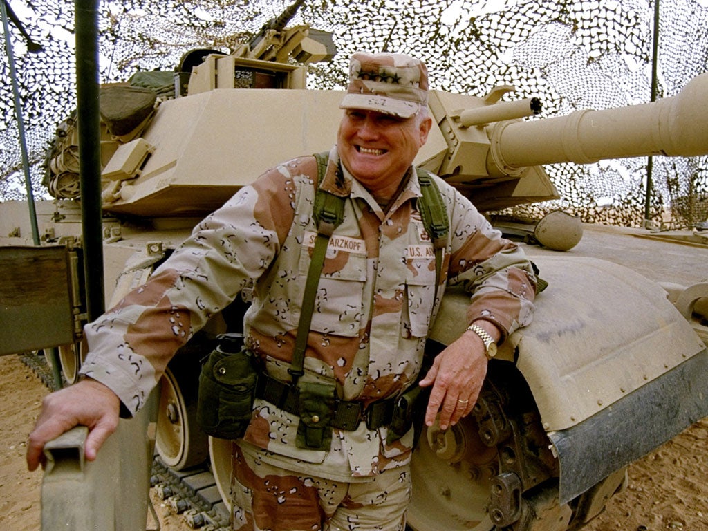 General H Norman Schwarzkopf stands with his tank troops during Operation Desert Storm