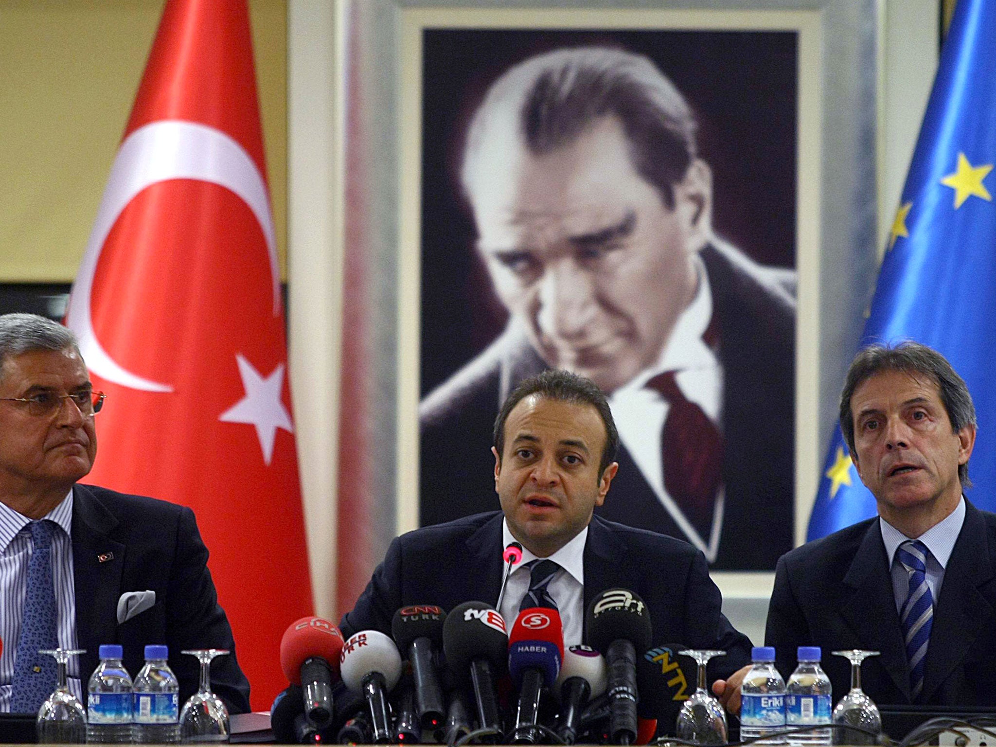 Turkish State Minister of Charges of European Union Egemen Bagis (C) speaks to the media in Ankara on November 9, 2010.