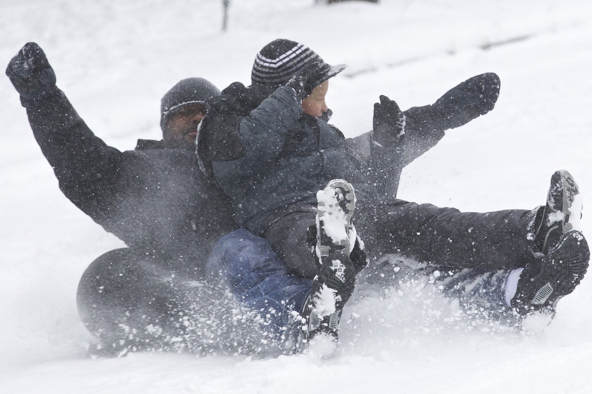 Video: Children on sledge collide with woman | The Independent | The ...