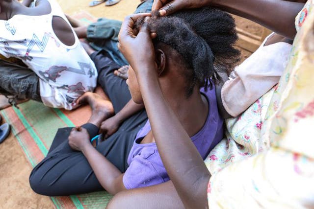 Clemence, 16, has her hair done after being reunited with her mother  