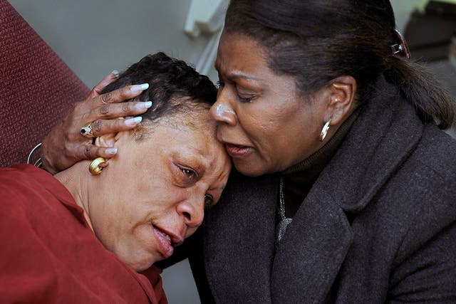 Pat Hawkins, left, is emotional after reuniting with her cousin, Diane Holmes, of Richmond, California, who had just flown to Washington from California. The reunion took place at MedStar Washington Hospital Center, where Hawkins, who had suffered mini-st