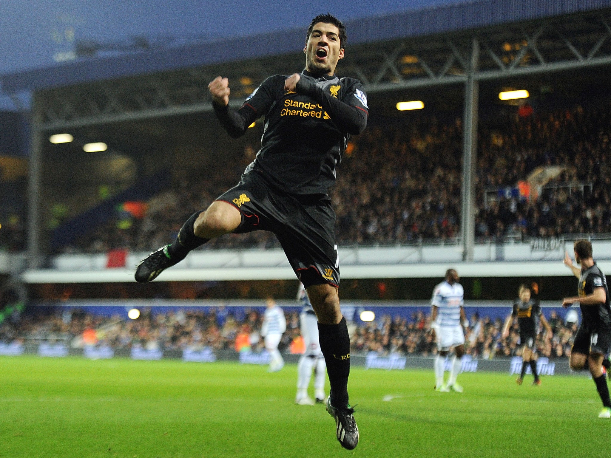 Luis Suarez celebrates his brace