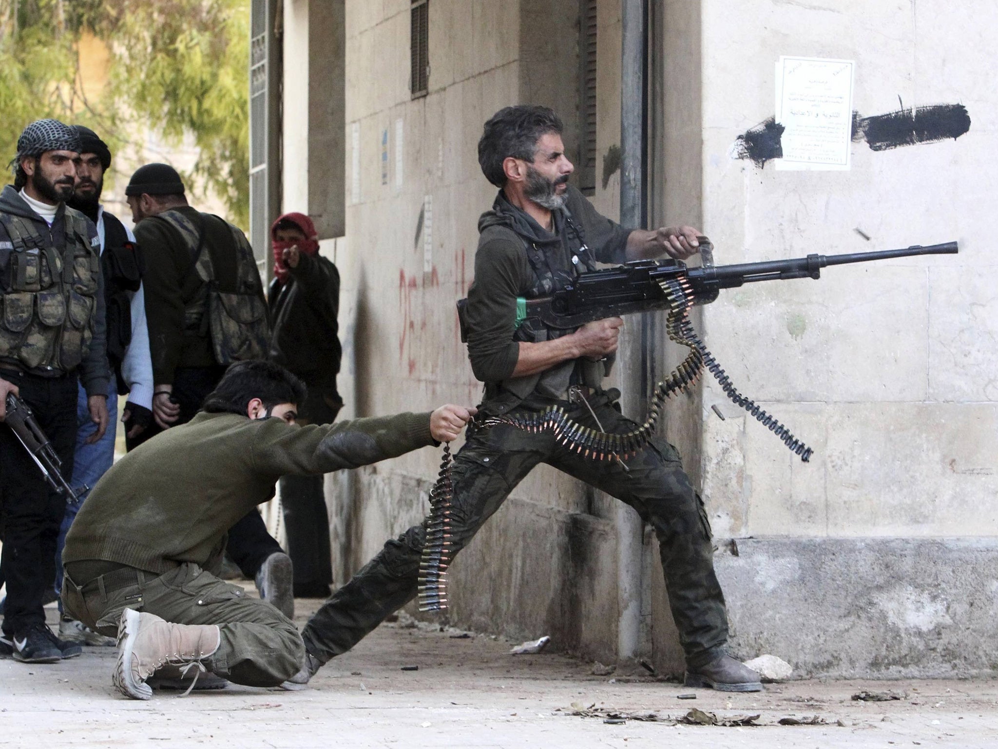 A Free Syrian Army fighter during a clash with regime forces