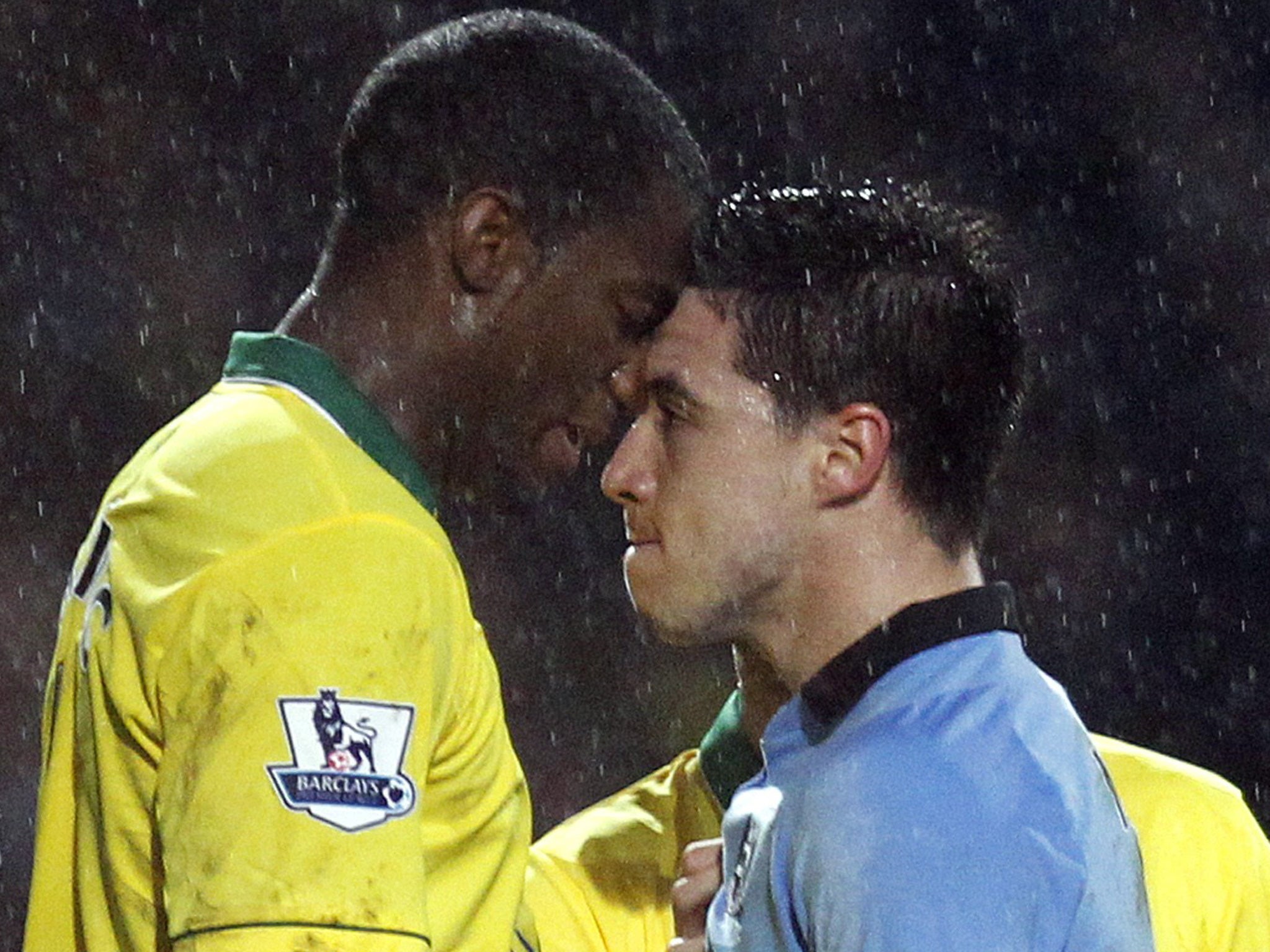 Manchester City’s Samir Nasri (right) gets up close and personal with Norwich’s Sebastien Bassong on Saturday. Nasri was sent off, Bassong received a yellow card