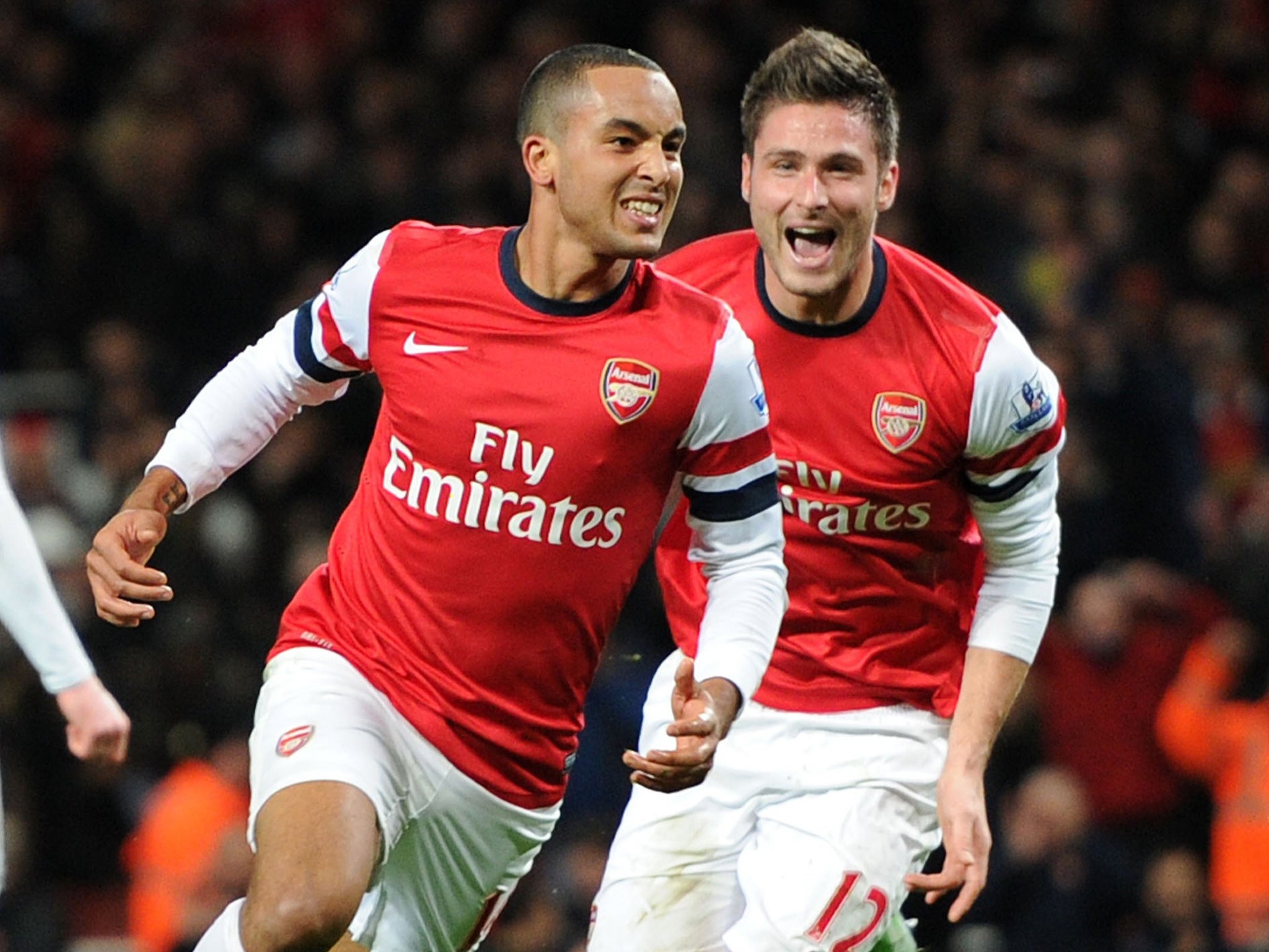 Arsenal’s hat-trick hero Theo Walcott (left) celebrates with Olivier Giroud on Saturday