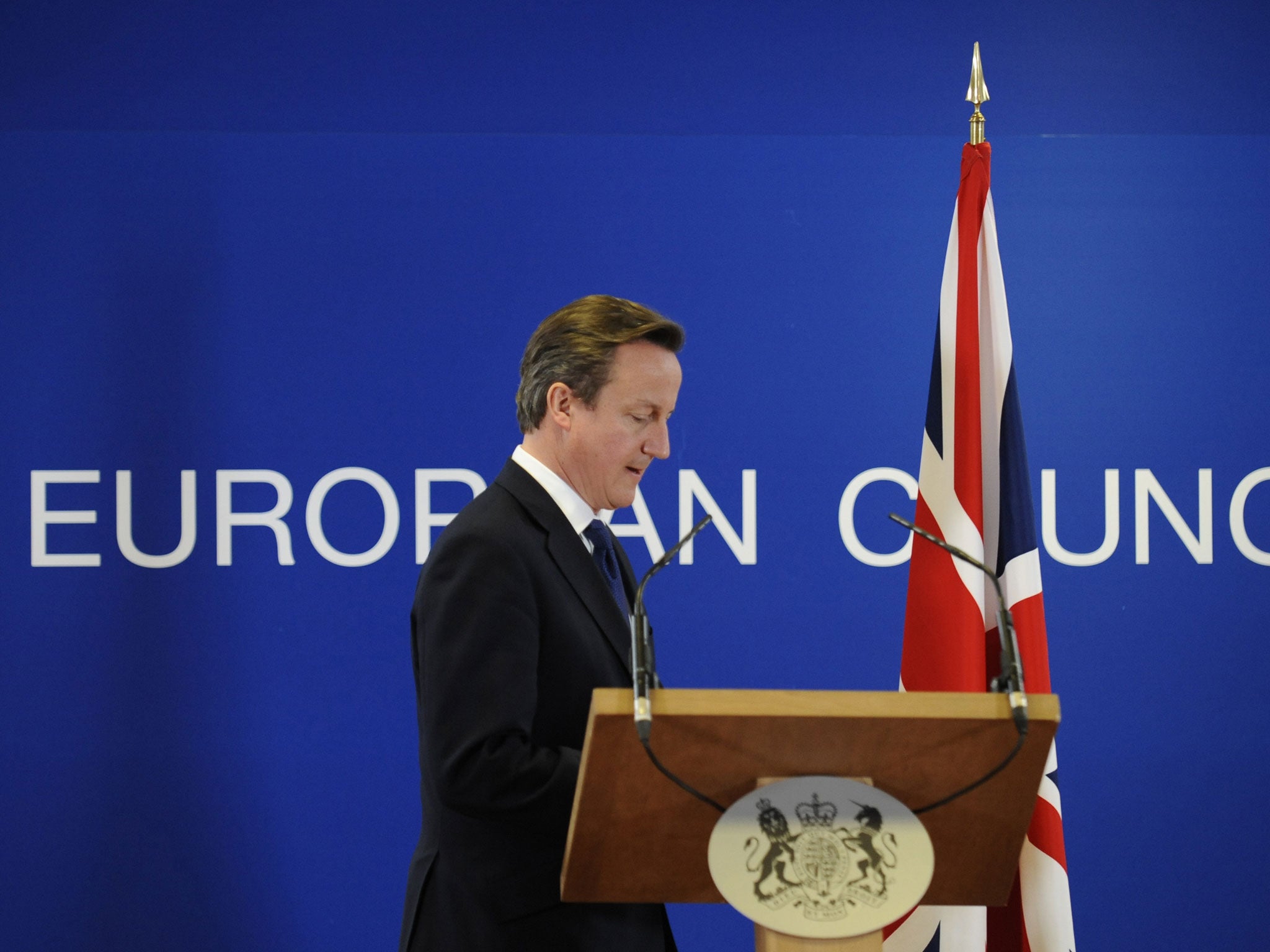 David Cameron arrives to give a press conference at the EU Headquarters, on November 23, 2012 in Brussels, after a two-day EU leaders budget summit.