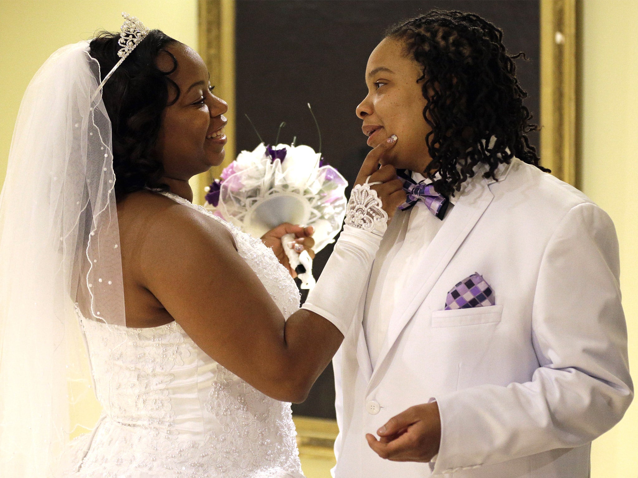 Darcia Anthony, left, and Danielle Williams chat before their wedding at City Hall in Baltimore