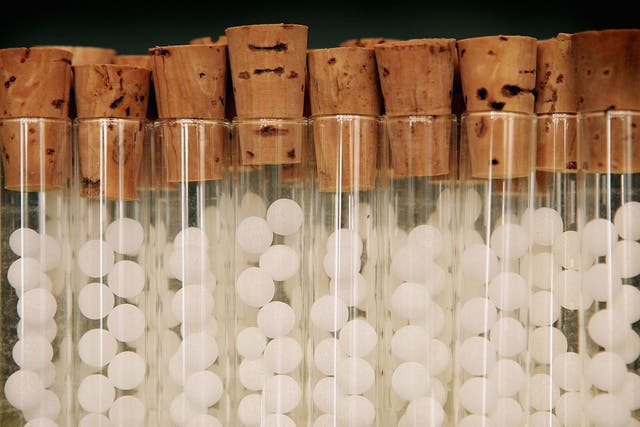 Vials containg pills for homeopathic remedies are displayed at Ainsworths Pharmacy on August 26, 2005 in London.