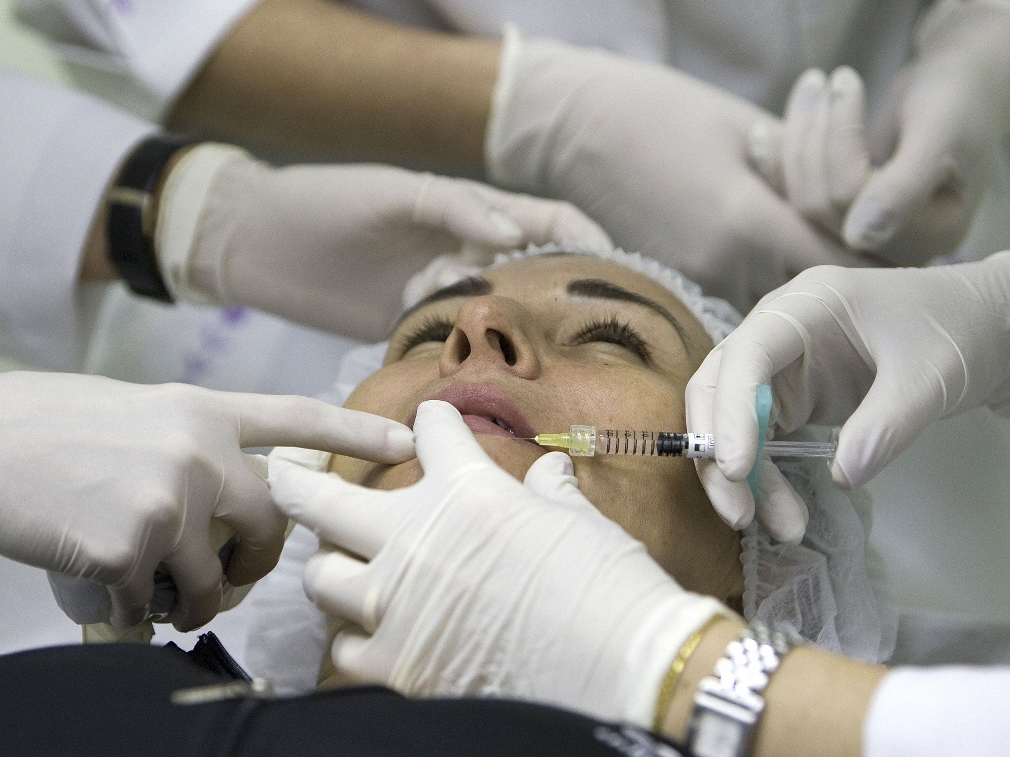 Leila Veiga receives a treatment with hialuronic acid at the Brazilian Society for Aesthetic Medicine, as part of a free beauty treatment, on November 13, 2008 in Rio de Janeiro, Brazil.