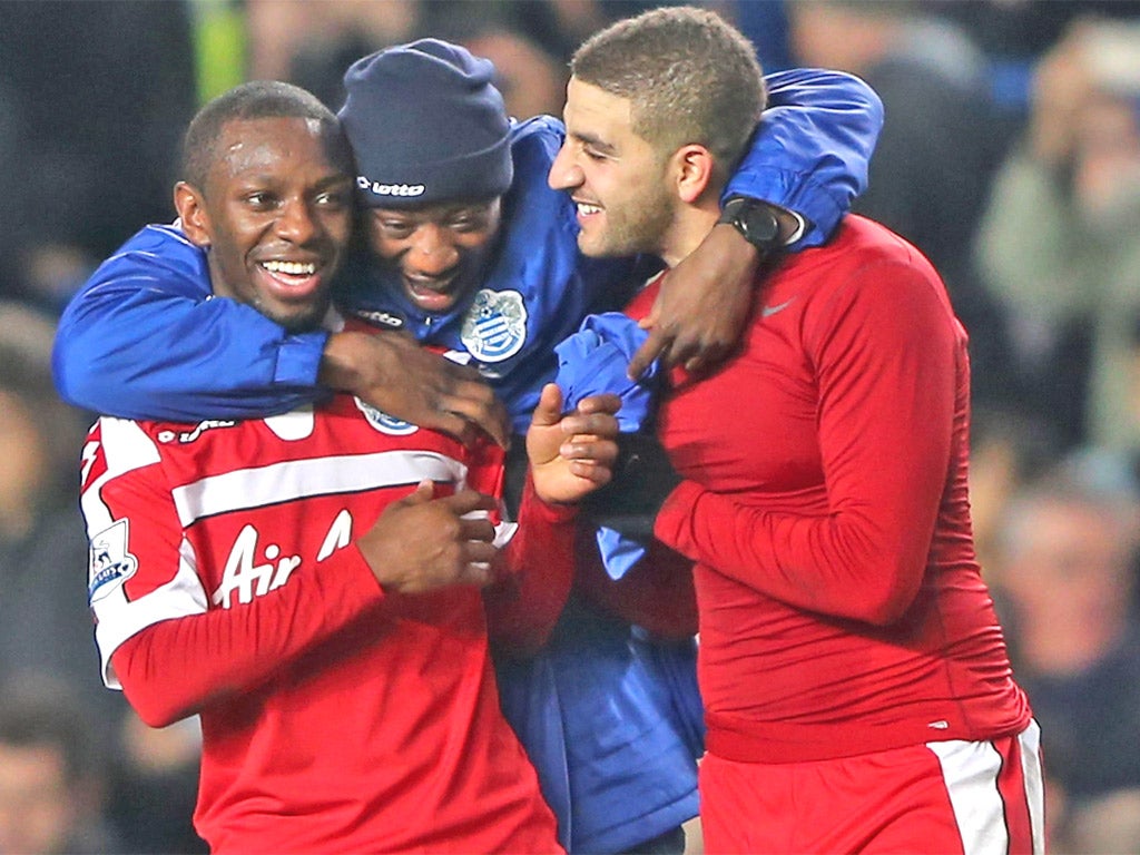 QPR goalscorer Shaun Wright-Phillips (left) celebrates victory at Stamford Bridge
