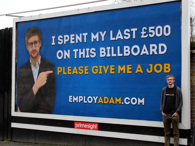 Gissa job: Adam Pacitti poses in front of the billboard he hopes will bring work 