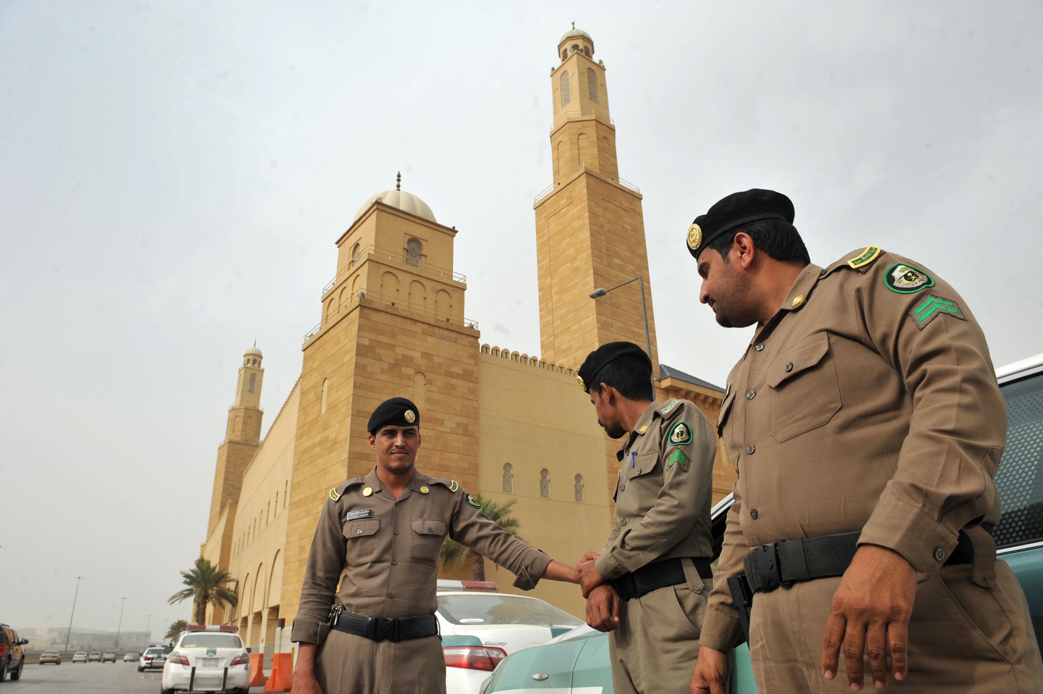 Saudi policemen stand guard in front of 'Al-rajhi mosque' in central Riyadh