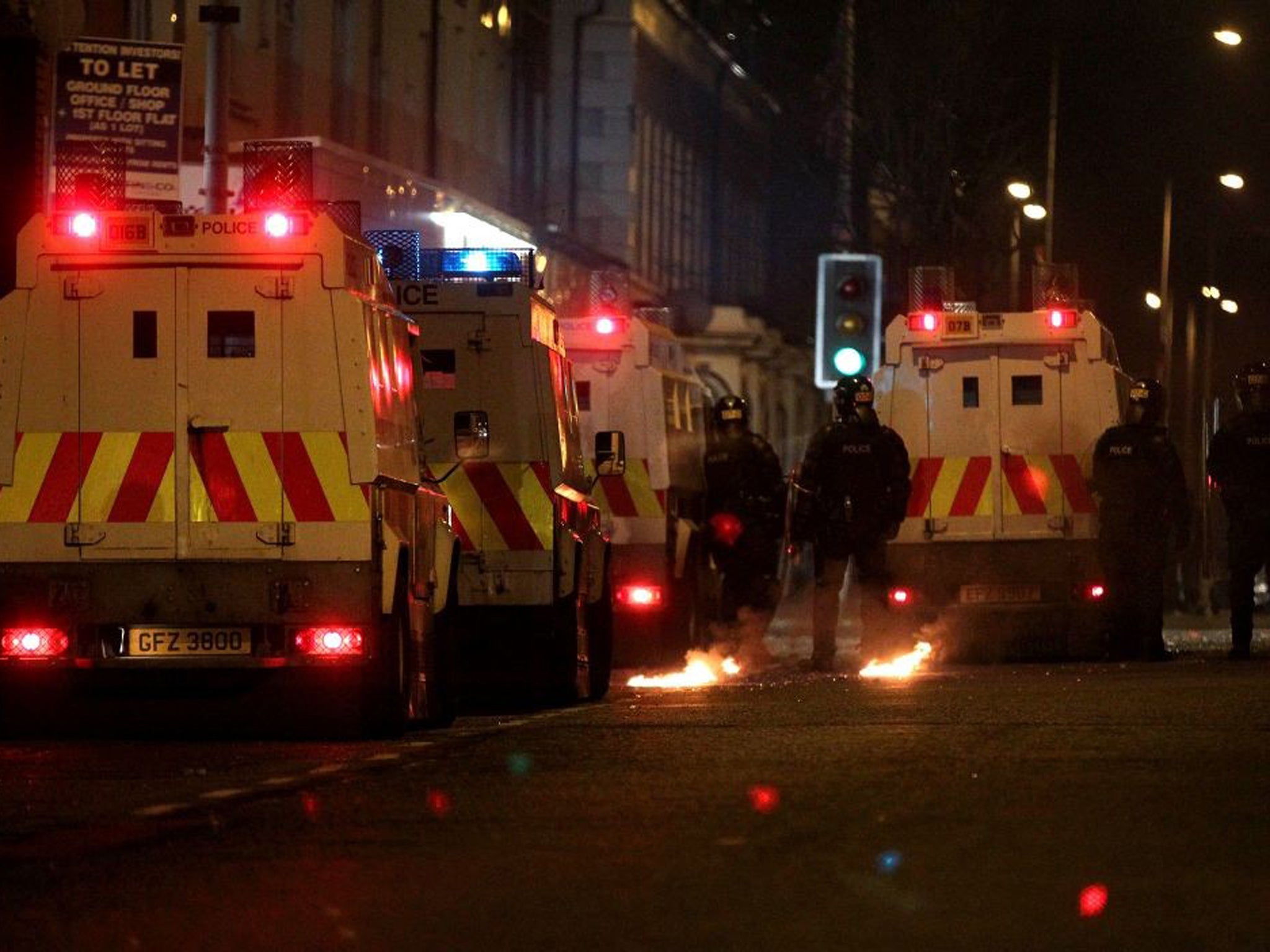 Police stand guard during last night's protests in Belfast